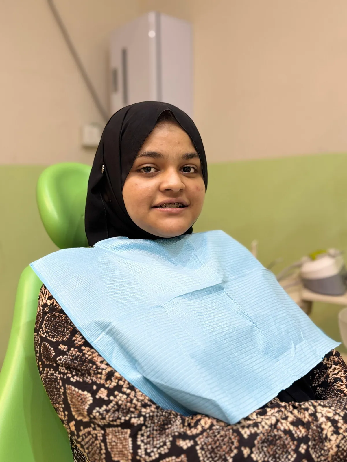 An orthodontist reviewing a digital treatment plan with a patient